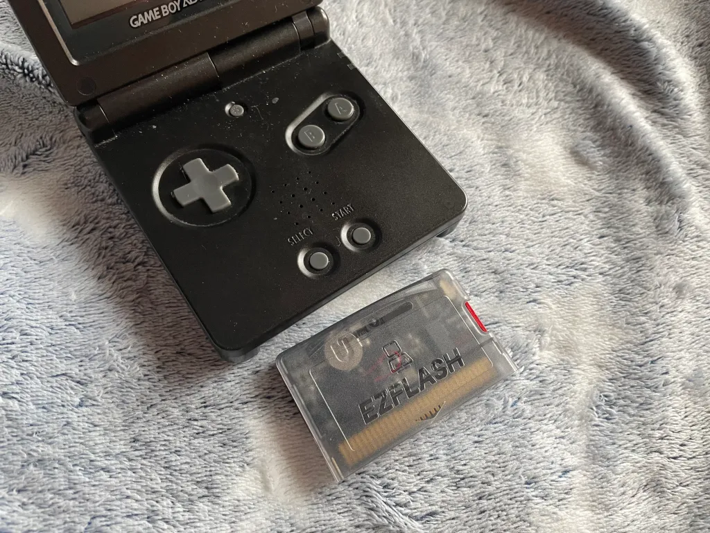 A Game Boy Advance system with an associated flash cartridge