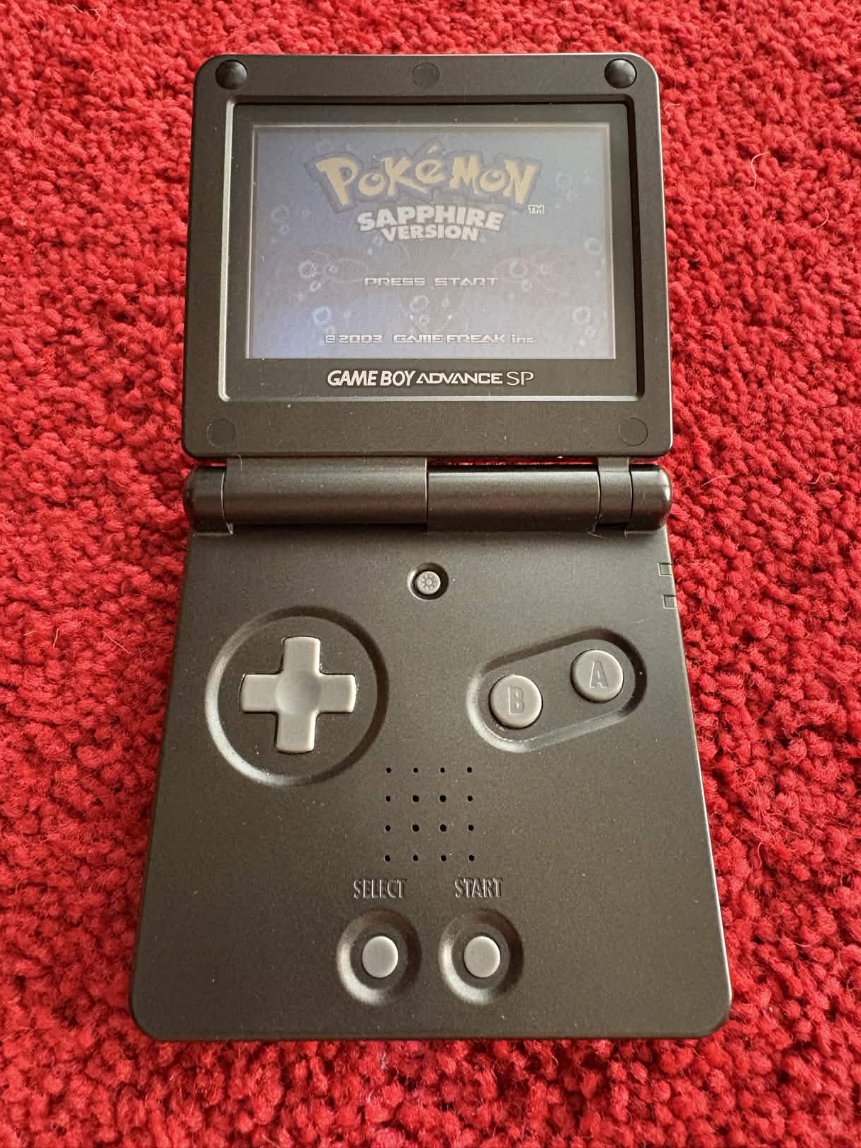 A photo of Pokémon Sapphire on a Game Boy Advance