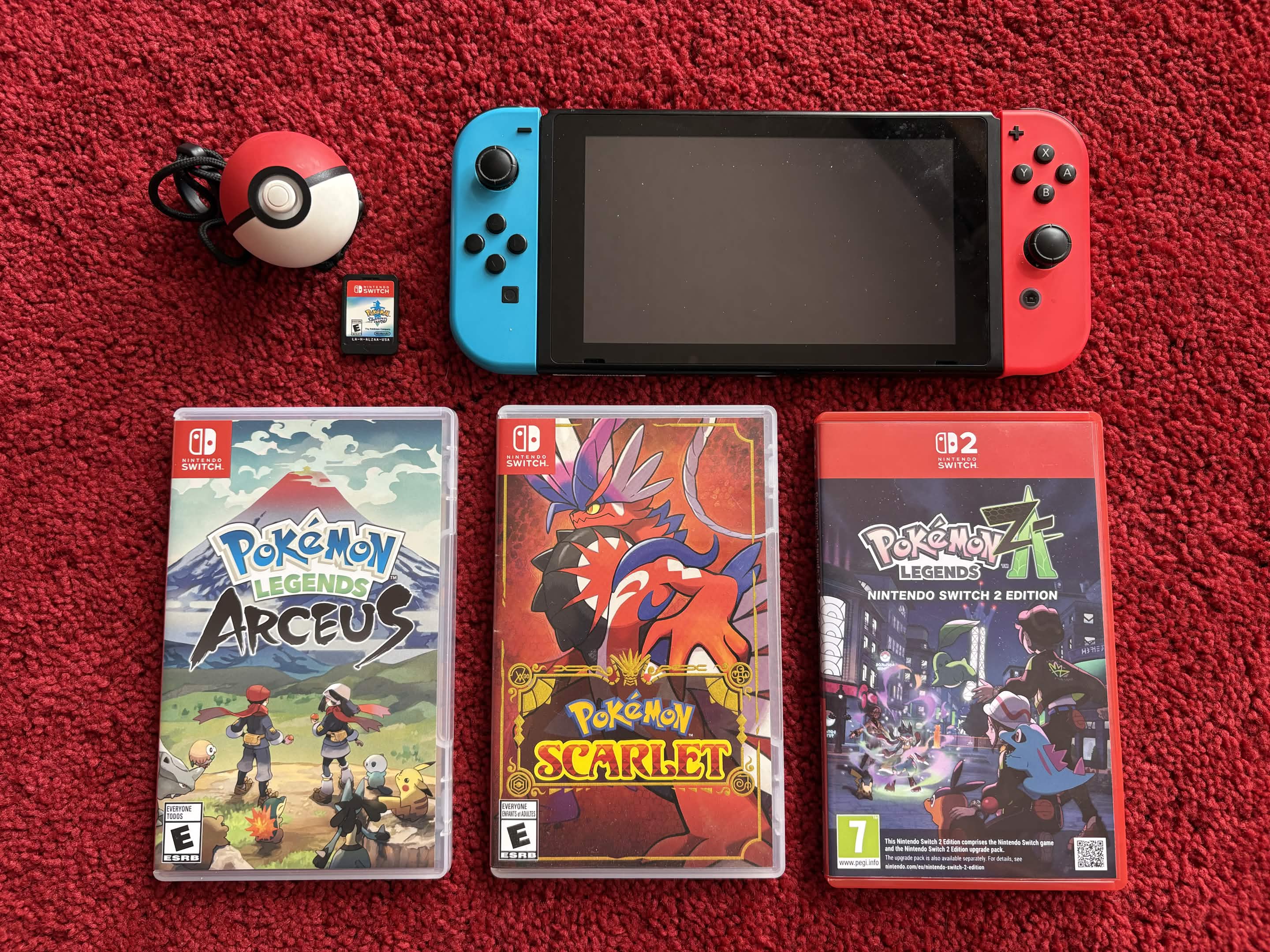 A photo of my Switch console and games